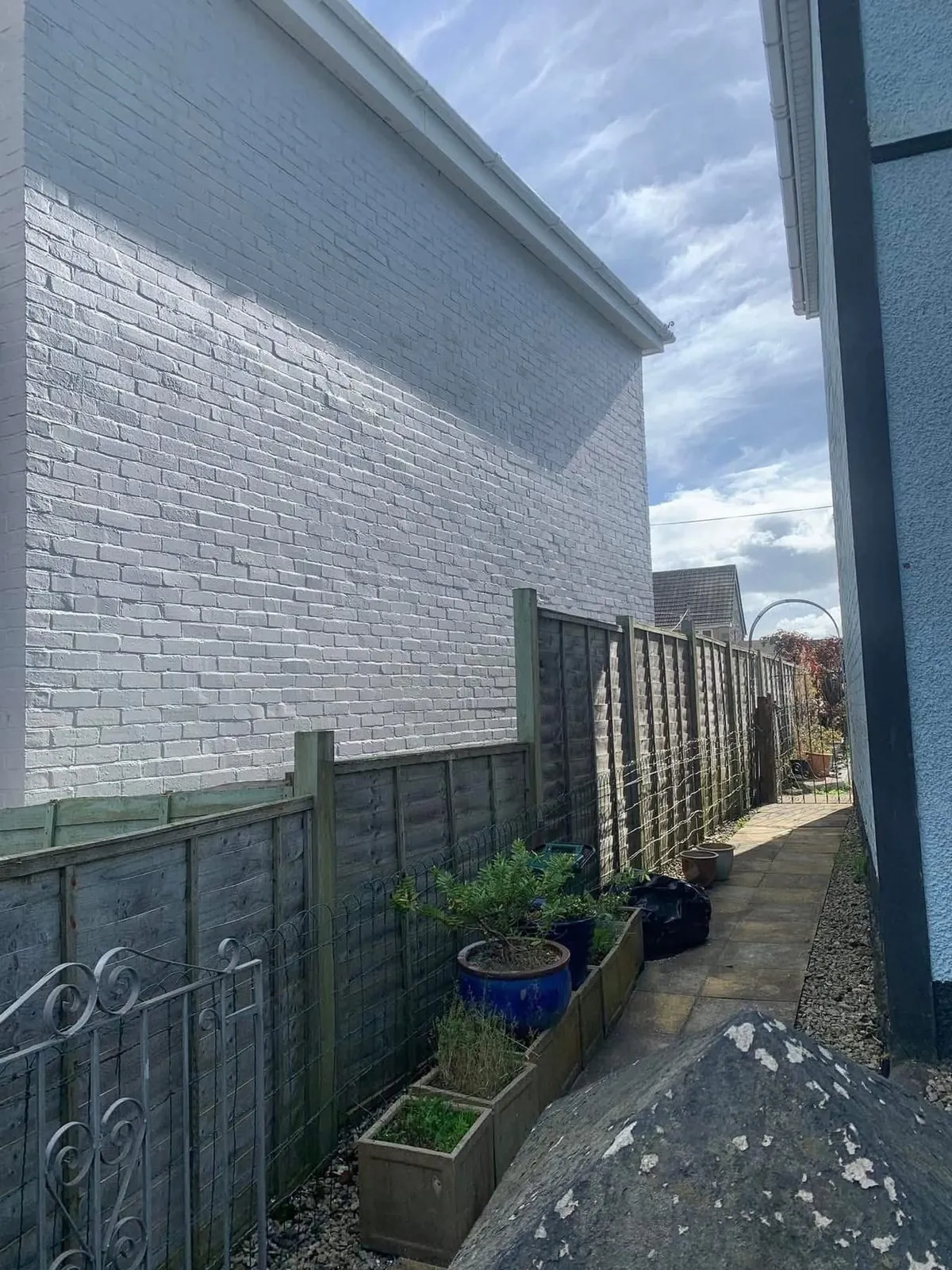 Freshly painted brick wall after preparation and masonry paint in Launceston